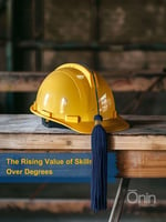 Yellow hard hat with a graduation tassel, symbolizing the rising value of skills over degrees in the industrial job market