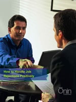 Two men sitting across from one another during a job interview